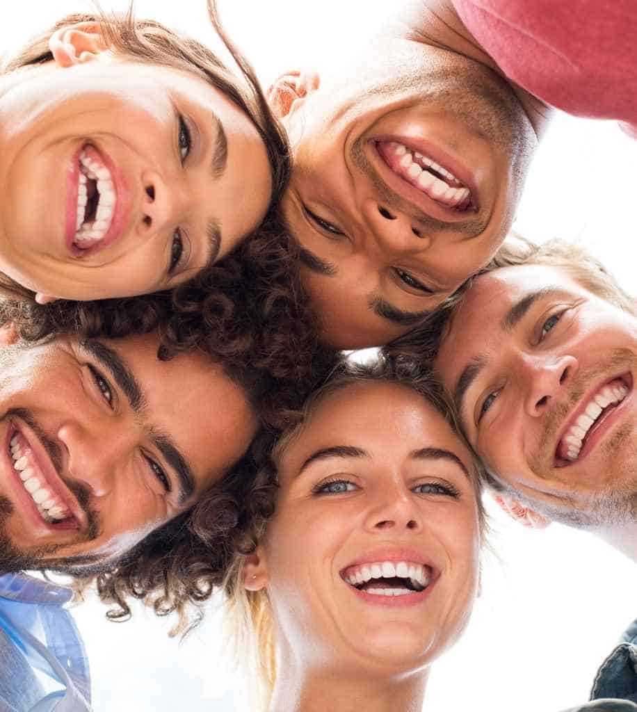 Smiling person showcasing white teeth after laser whitening treatment Basildon